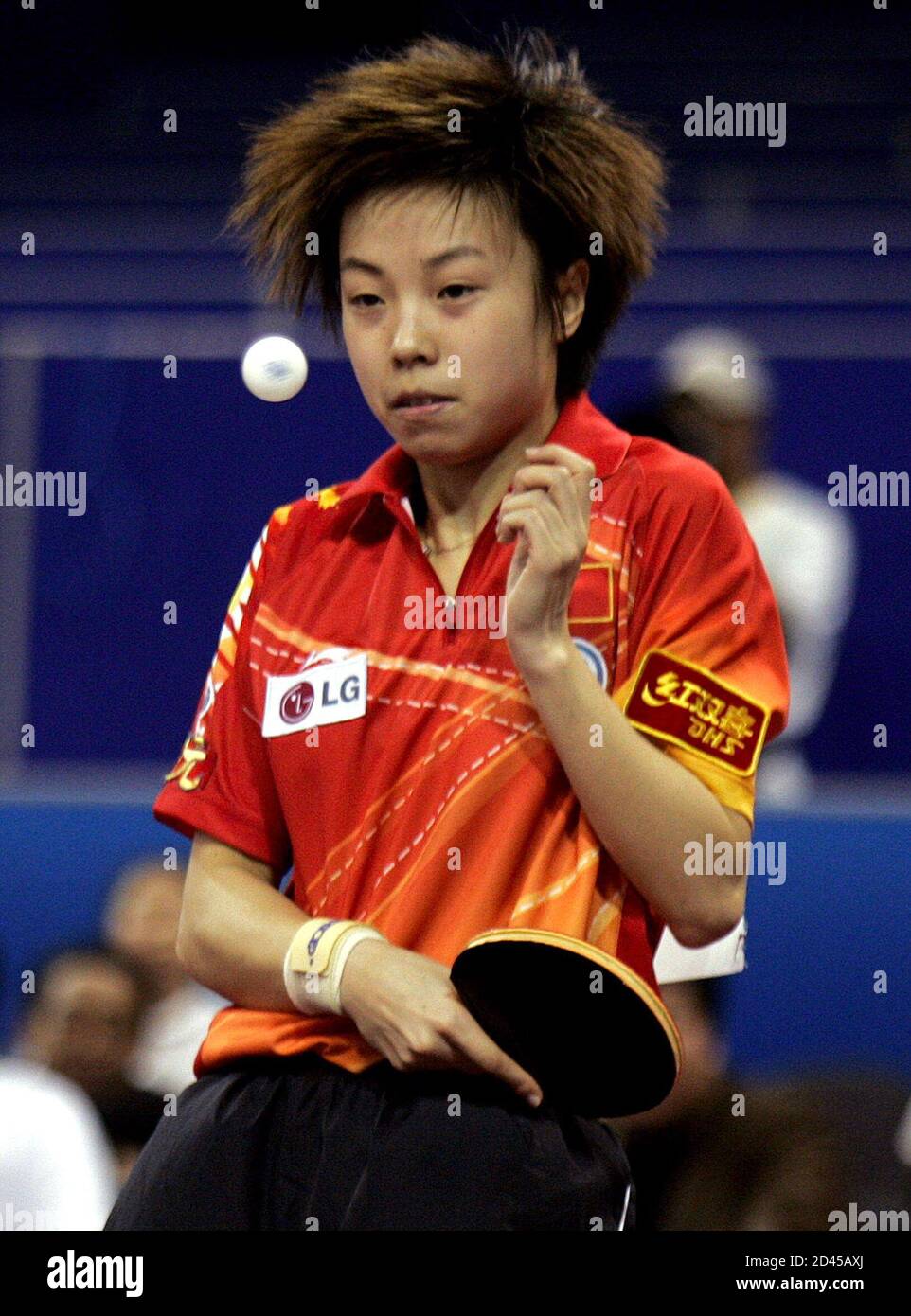 Chinese player Zhang plays a shot in match against Guo and Yan of China at  48th World Table Tennis Championships in Shanghai. Chinese player Zhang  Yining plays a shot in her mixed