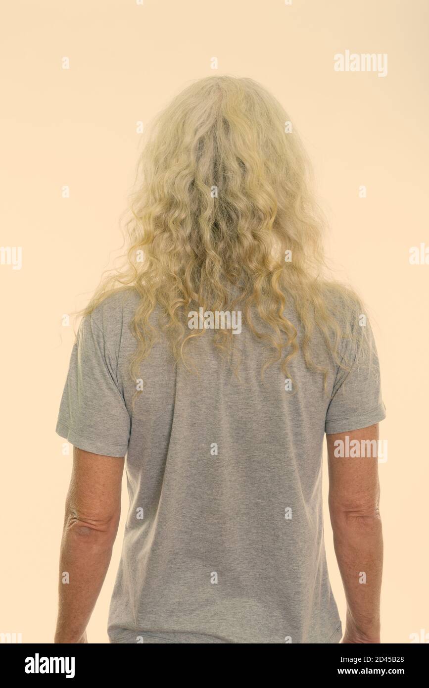 Back view of senior bearded man with long curly white hair Stock Photo