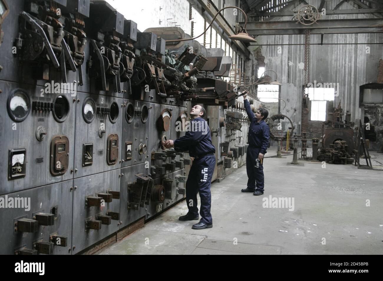 A tour guide checks what was the power station of the the famous meat
