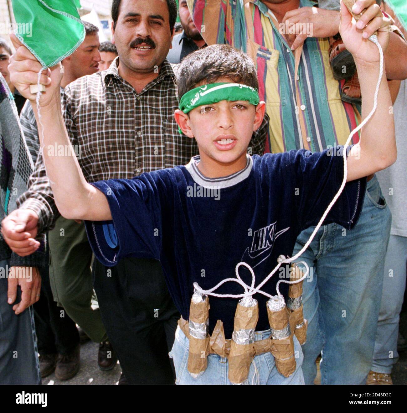 a-palestinian-boy-dresses-like-a-suicide-bomber-during-a-land-day-demonstration-in-the-west-bank-city-of-ramallah-march-30-2001-israeli-arabs-took-to-the-streets-again-on-friday-for-the-annual-land-day-demonstrations-commemorating-the-25th-anniversary-of-the-killing-of-six-arab-israelis-by-israeli-soldiers-during-mass-protests-in-1976-clashes-erupted-throughout-the-west-bank-and-gaza-strip-and-israeli-troops-opened-fire-with-live-rounds-to-halt-palestinian-marches-ehcrb-2D45D2C.jpg