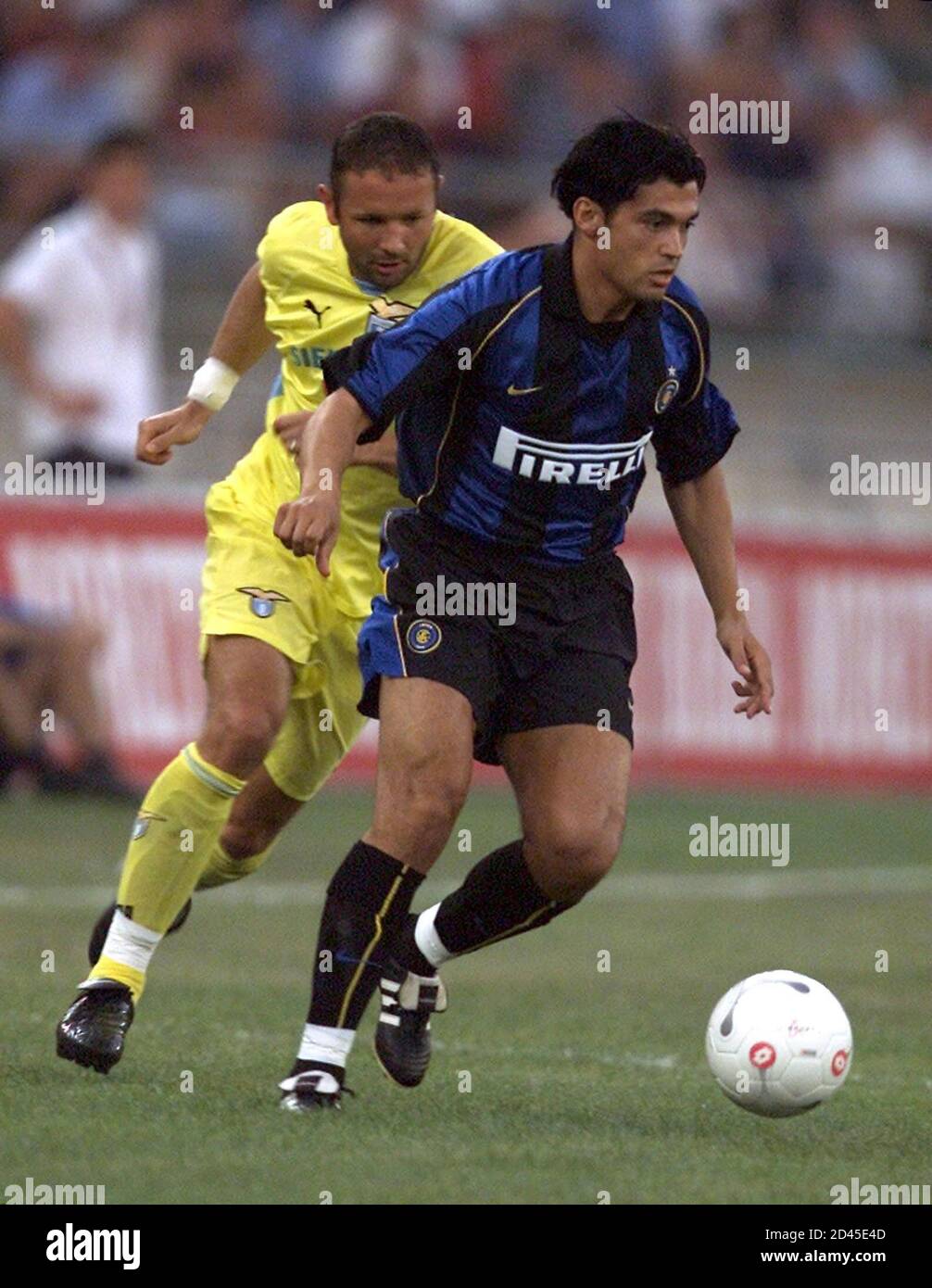 Inter Milan's Sergio Conceicao (R) runs with the ball followed by Lazio's  Sinisa Mihajlovic during a friendly soccer match as part of one day " Birra  Moretti trophy " beetwen Inter Milan,