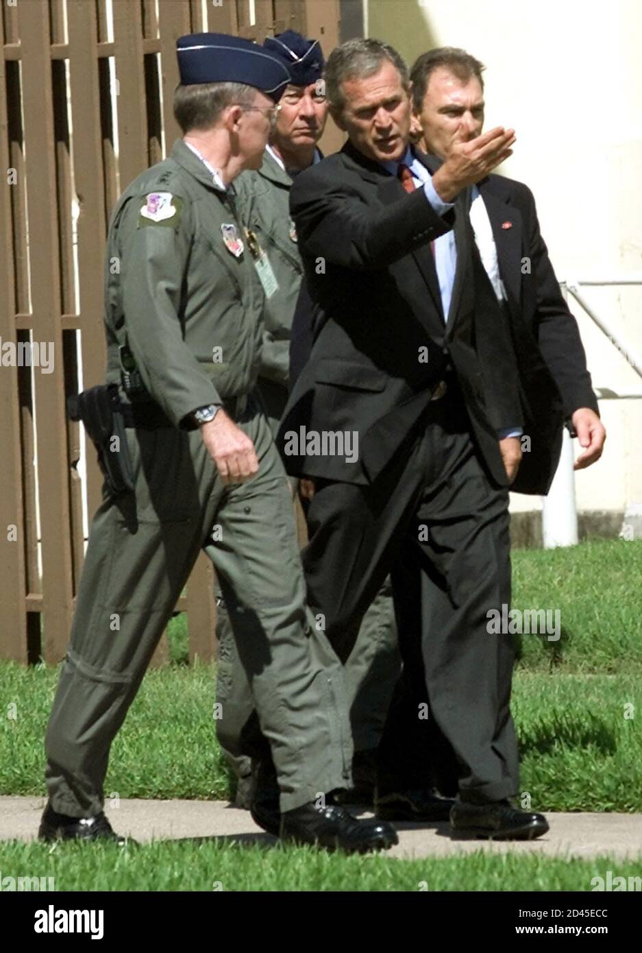 U.S. President George W. Bush walks with Lt. Gen Tom Keck, Commander of the 8th Air Force, at Barksdale AFB near Shreveport, Louisiana, September 11, 2001. Bush later departed Barksdale AFB for an undisclosed location after making a statement on the recent terrorist acts. REUTERS/Win McNamee  WM/ME Stock Photo