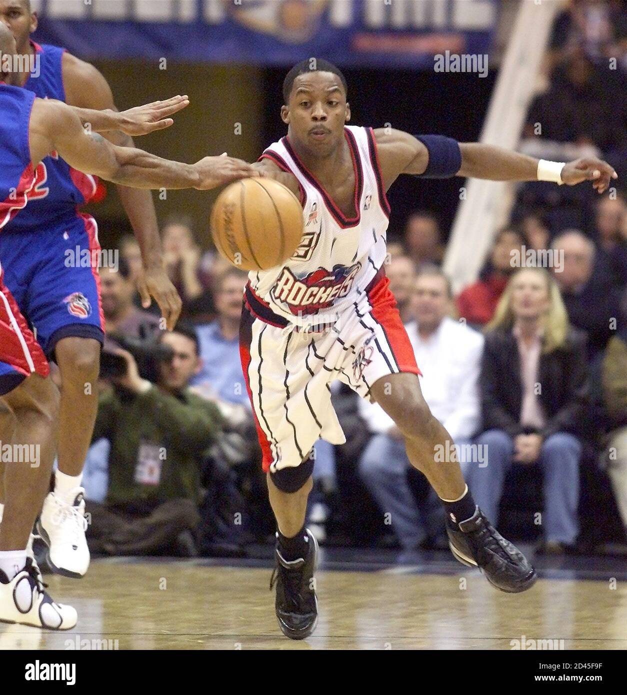 Houston Rockets guard Steve Francis (3) steals a pass from the Detroit Pistons during the first half January 3, 2002 in Houston. Francis' appearance marks his first start for the Rockets since missing 15 games due to a ruptured plantar fascia. REUTERS/Richard Carson  RJC Stock Photo