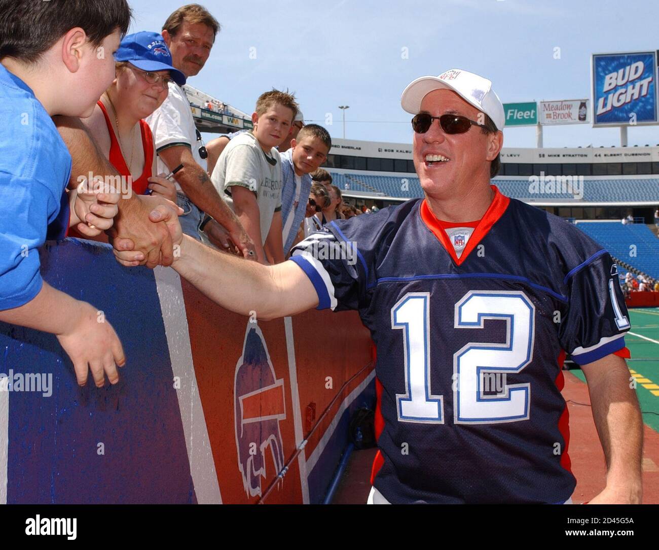 Retired Buffalo Bills quarterback Jim Kelly greets fans in the new Buffalo  Bills jersey on June 8, 2002. About 20,000 fans came out to Ralph Wilson  Stadium in Orchard Park, NY, to