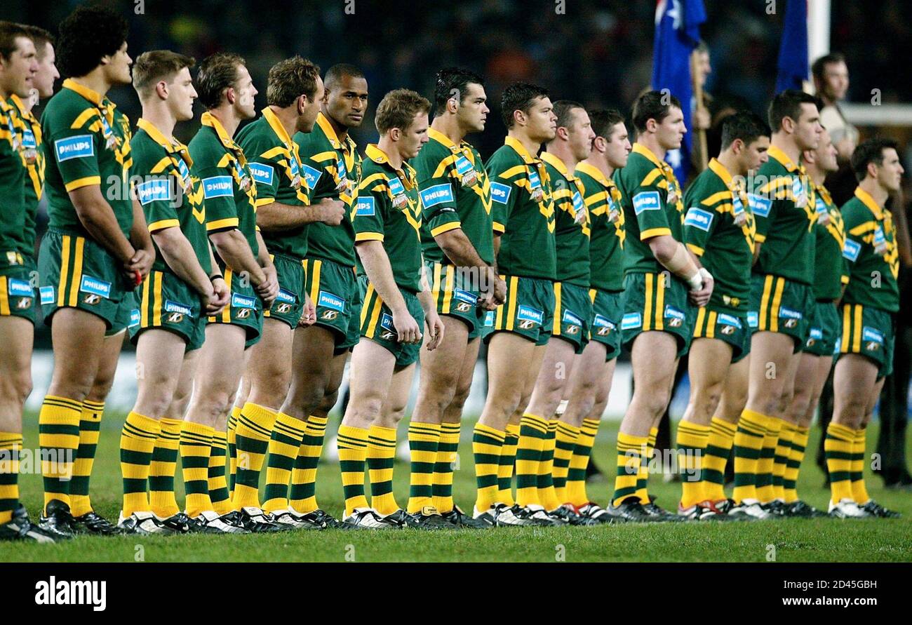 Members of the Australian team stand together for the national before the rugby league test match against Great Britain in Sydney 12, 2002. Australia defeated Great Britain 64-10 in the