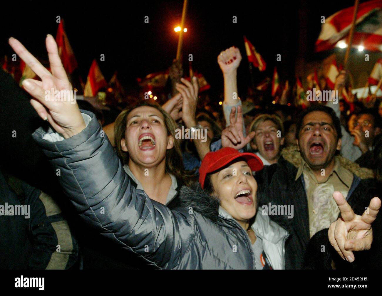 Lebanese protesters celebrate after Prime Minister Omar Karami resign in Beirut February 28, 2005. Lebanon's Syrian-backed Prime Minister Omar Karami,under popular pressure after assassination of an ex-prime minister,said on Monday his government was resigning. REUTERS/Mohamed Azakir  JS/THI Stock Photo