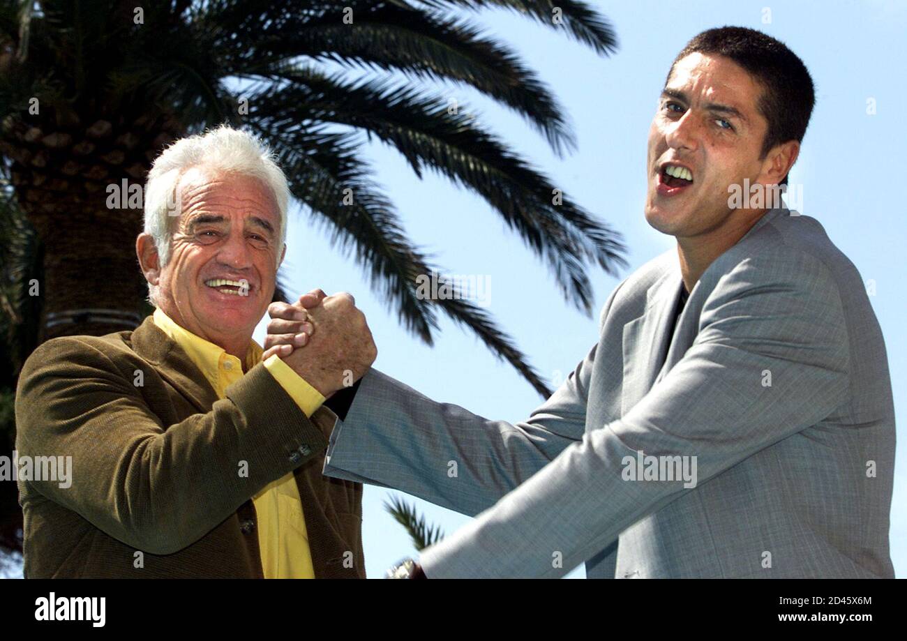 Veteran French movie star Jean-Paul Belmondo (L) arm wrestles with French  actor Samy Naceri (R) during a photocall at the 38th MIPTV, the  International Television Programs Market in Cannes, April 3, 2001.