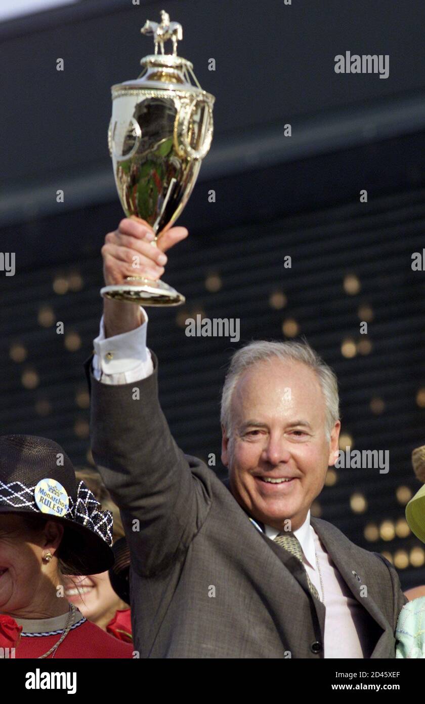 Monarchos owner John Oxley holds the Kentucky Derby Trophy in the