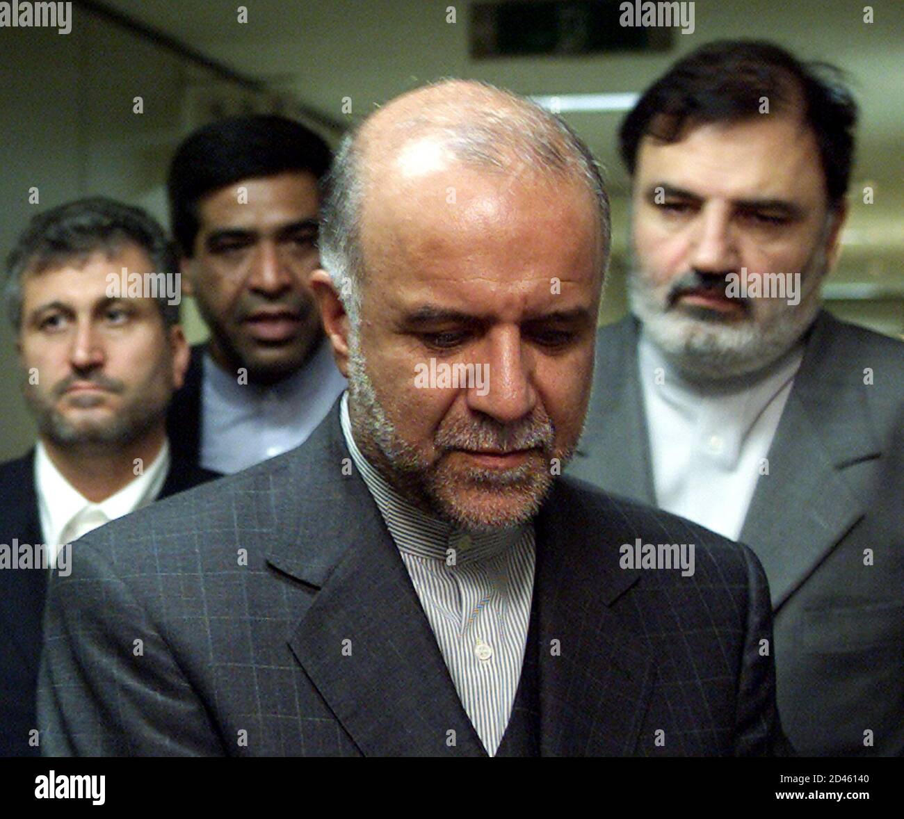 Iran's Oil Minister Bijan Zanganeh (C) stands after he visited the South Korean Ministry of Commerce, Industry and Energy in Seoul April 10, 2002. Zanganeh said on Wednesday his country would join Iraq's decision to suspend oil exports if another Muslim nation did likewise. Iraq on Monday took the decision to halt daily exports of some two million barrels for one month to protest against Israeli incursions into Palestinian areas. REUTERS/Lee Jae-Won  LJW/CP Stock Photo
