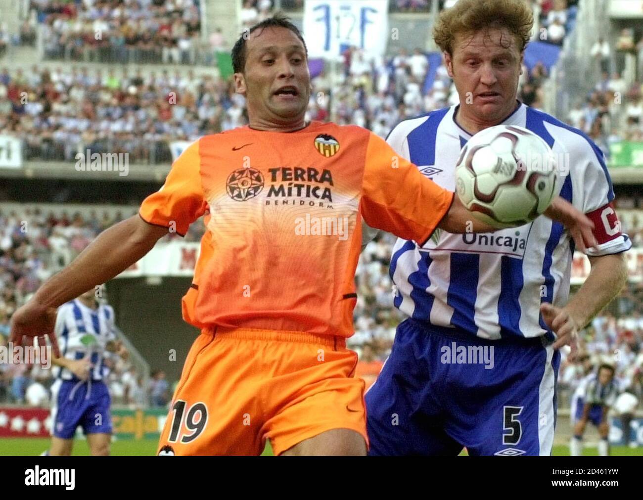 Malaga's Miguel Angel Roteta (R) and Valencia's Francisco Rufete try to  control the ball during their First Division soccer match at Malaga's La  Rosaleda stadium, on September 22, 2002. The match finished