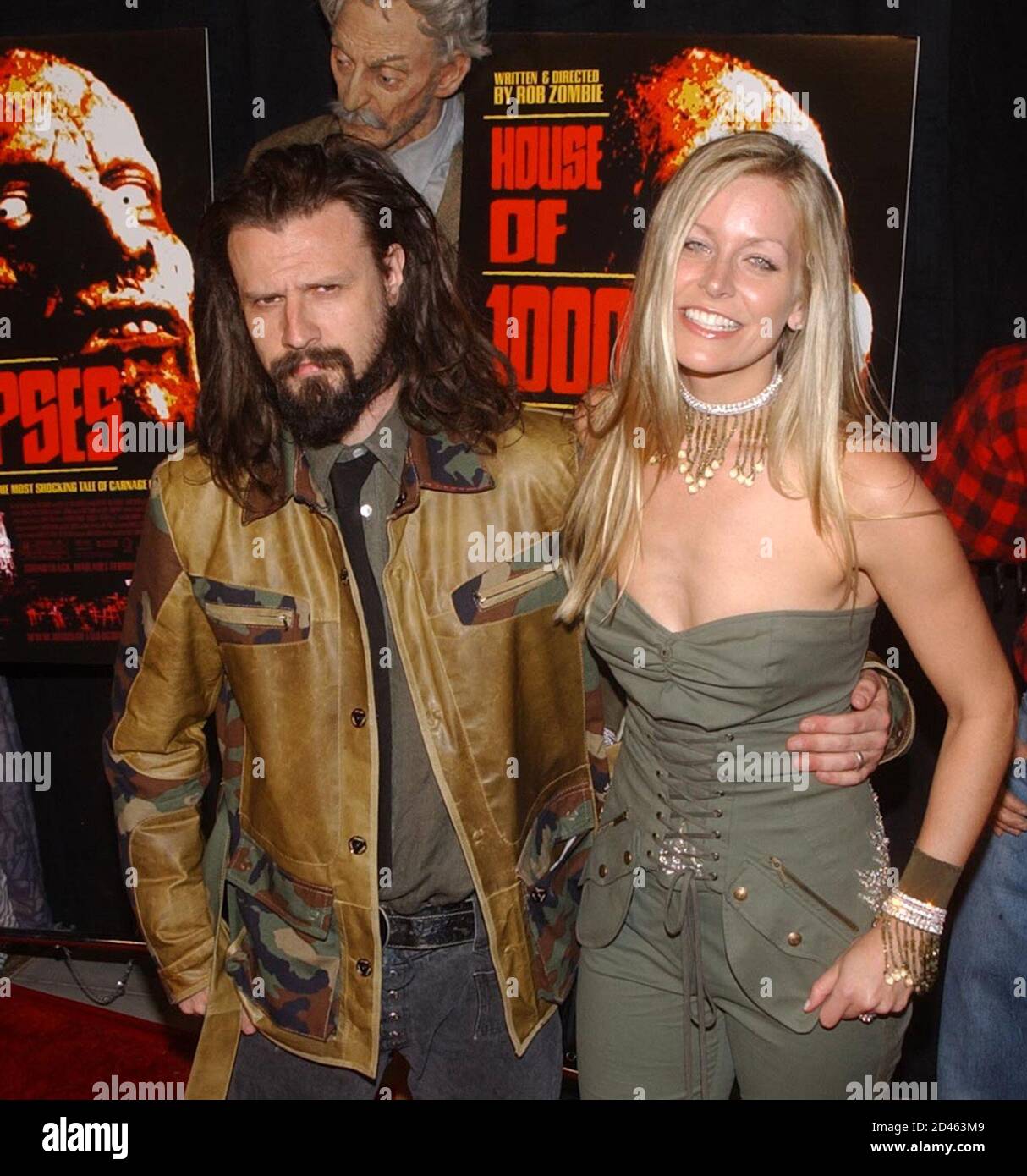 Musician Rob Zombie, who wrote and directed the horror motion picture "House  of 1000 Corpses," poses with his longtime girlfriend and cast member Sheri  Moon as they arrive at the premiere of