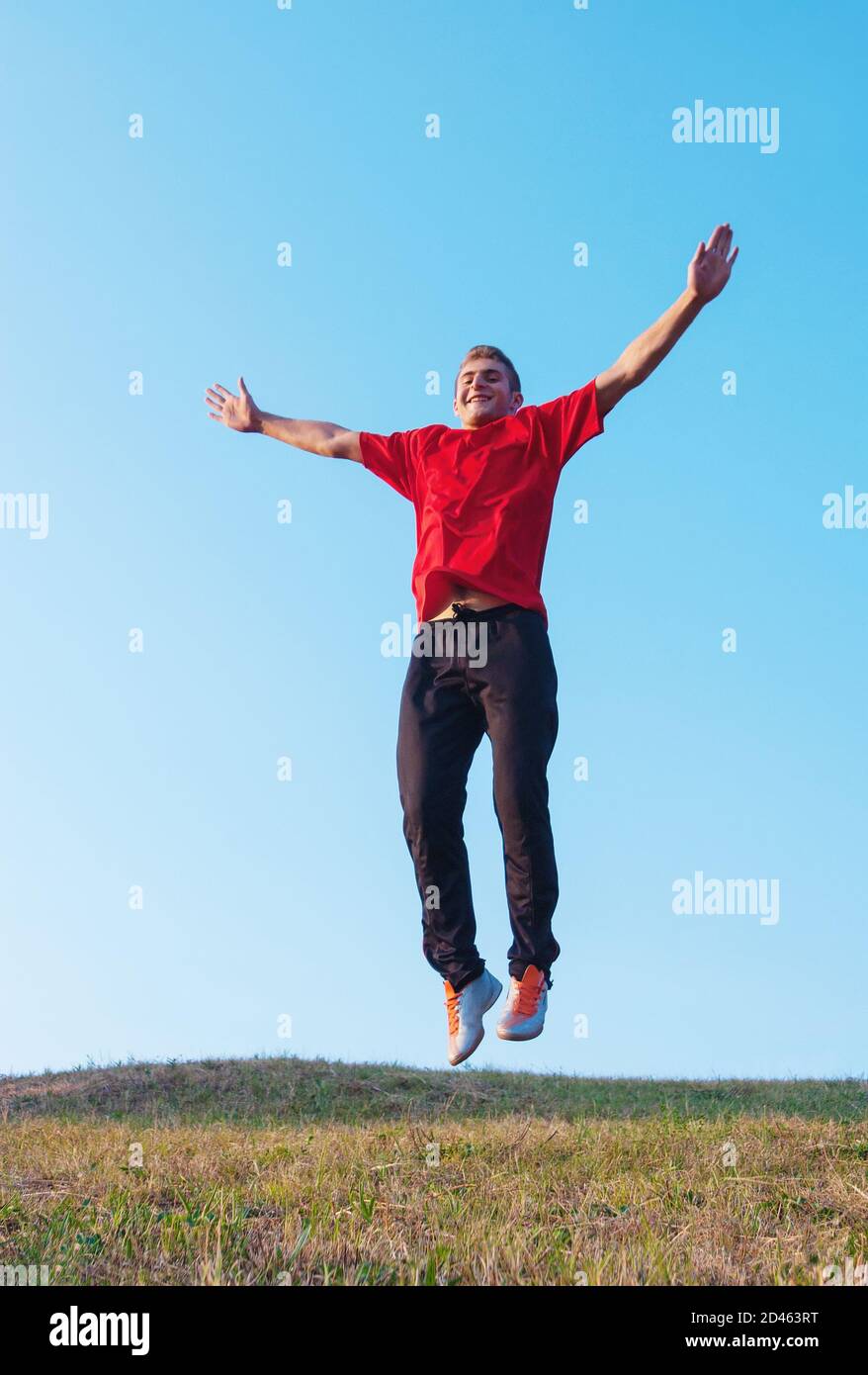 Photo of man jumping from ground represents freedom Stock Photo Alamy