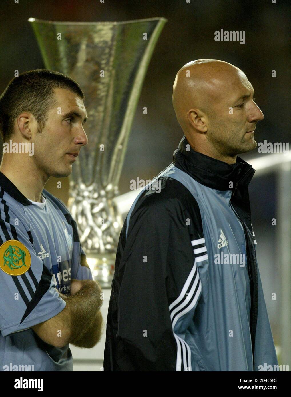 Olympique Marseille S Goal Keeper Fabien Barthez R And Laurent Batlles Walk Passed The Uefa Cup After