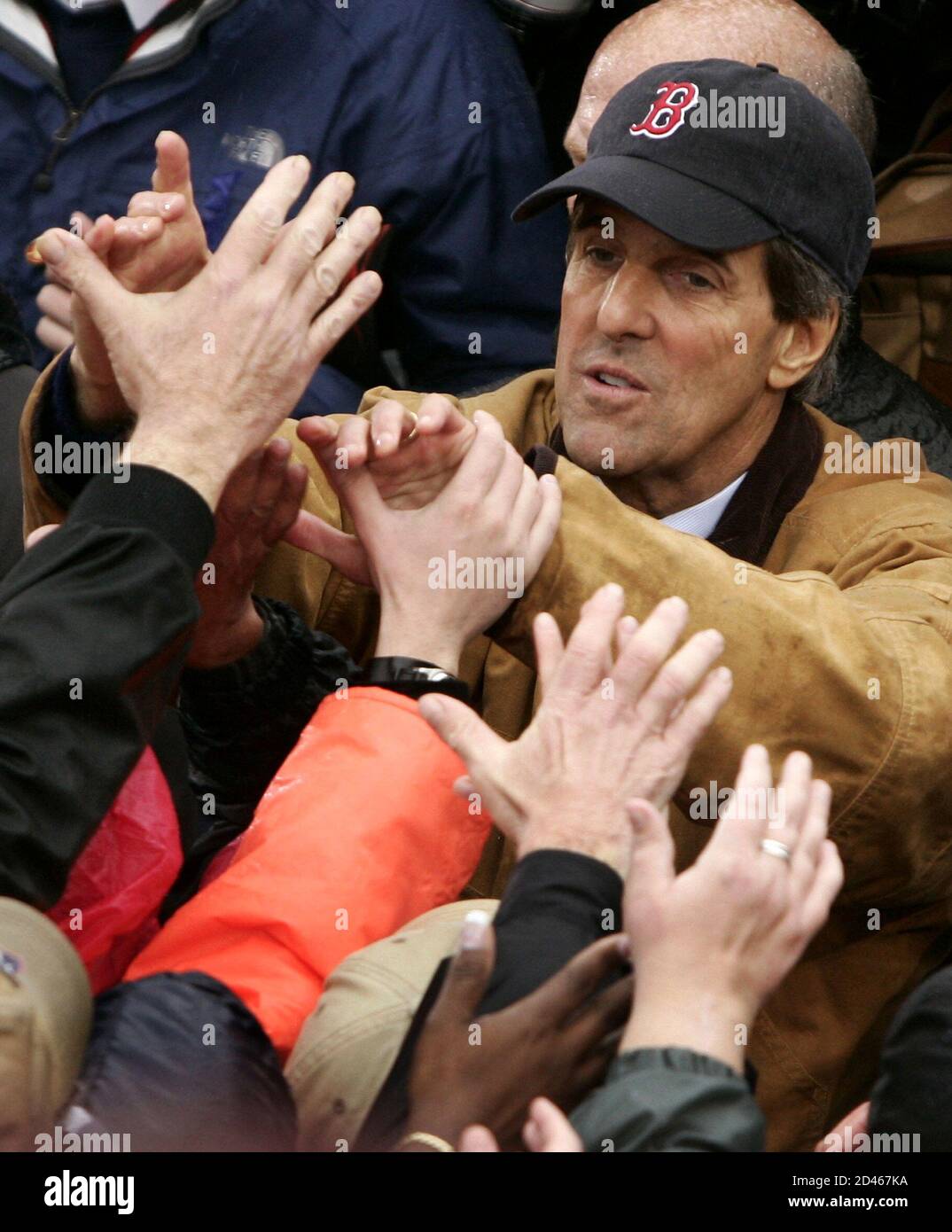 Wearing a Boston Red Sox baseball cap 