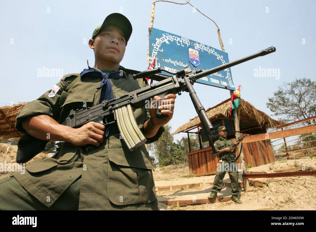 Two Myanmar Ethnic Karen Soldiers Stand Guard At The Kaw Htoo Lae Camp Inside The Former Burma Across The Moei River That Marks The Border With Thailand February 28 05 The Commander Of