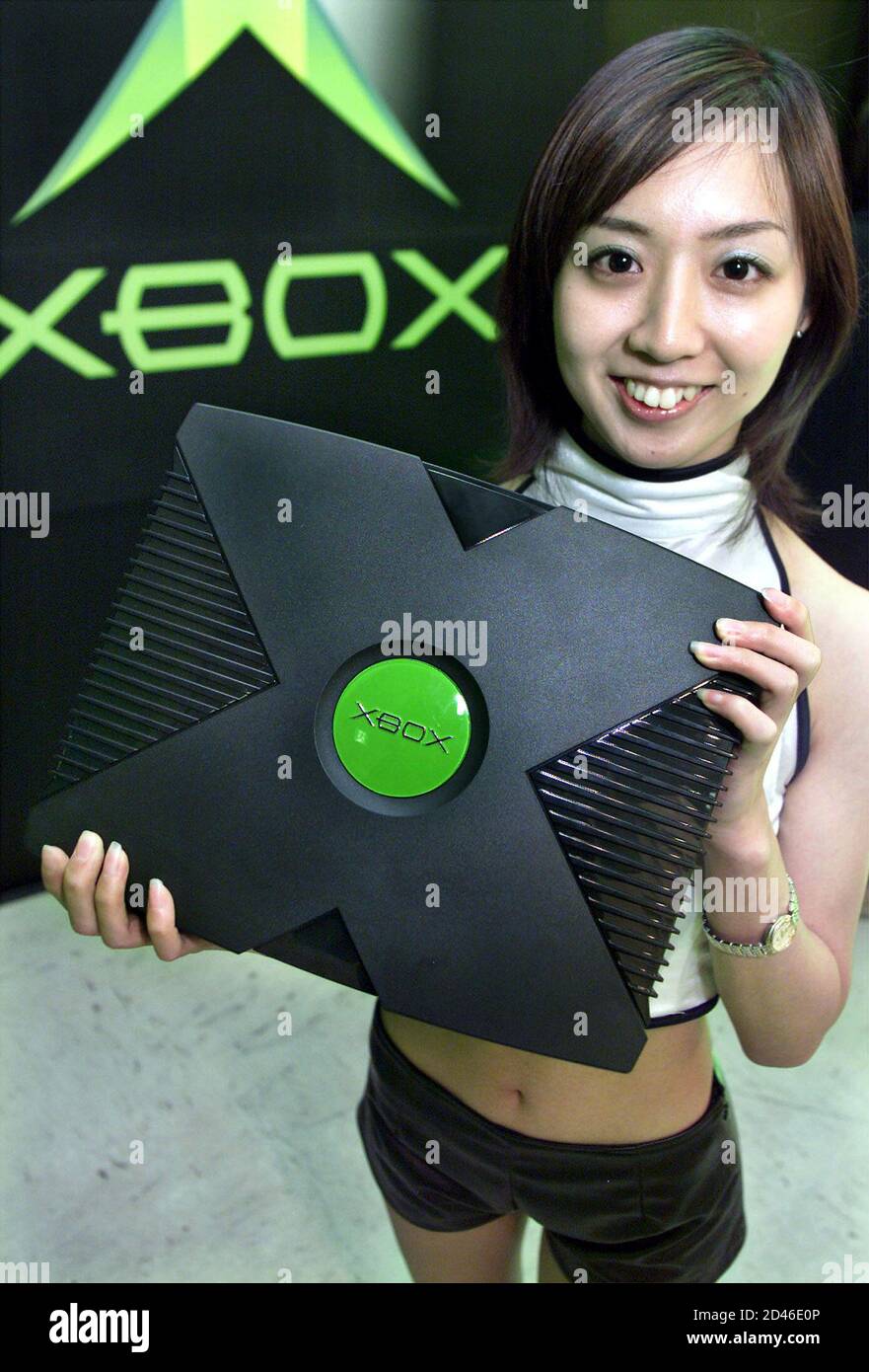 Microsoft's Xbox promoter "X-girl" Naoko Suzuki shows off the  next-generation videogame console at an "Xbox Experience" pre-sales launch  event in Tokyo February 20, 2002. Xbox sales kick off in Japan on February