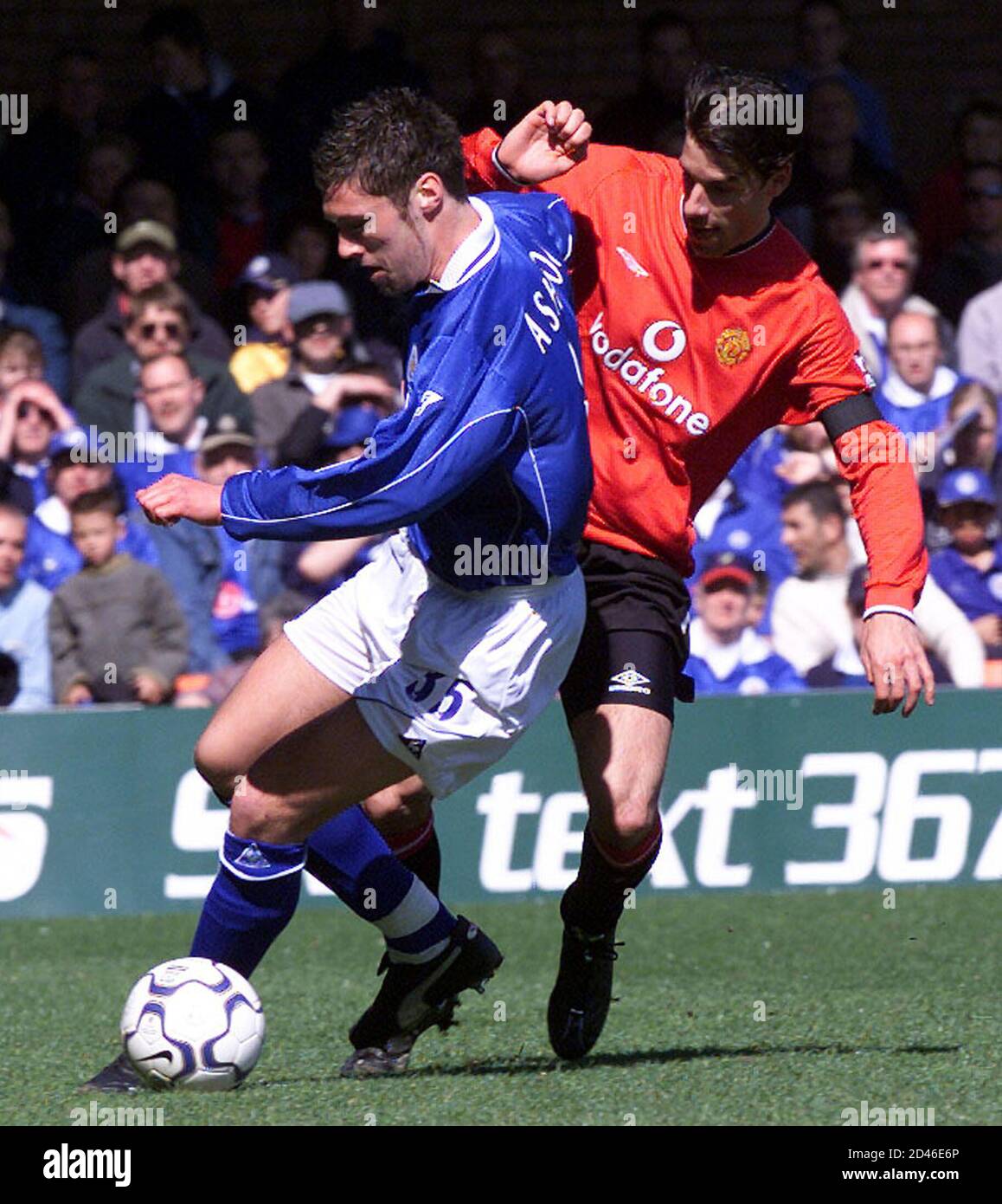 Manchester United's Dutch player Ruud Van Nistelrooy (R) tries to tackle  Leicester City's Jon Ashton during their English premier league match at  Filbert Street, April 6, 2002. Manchester United won the match