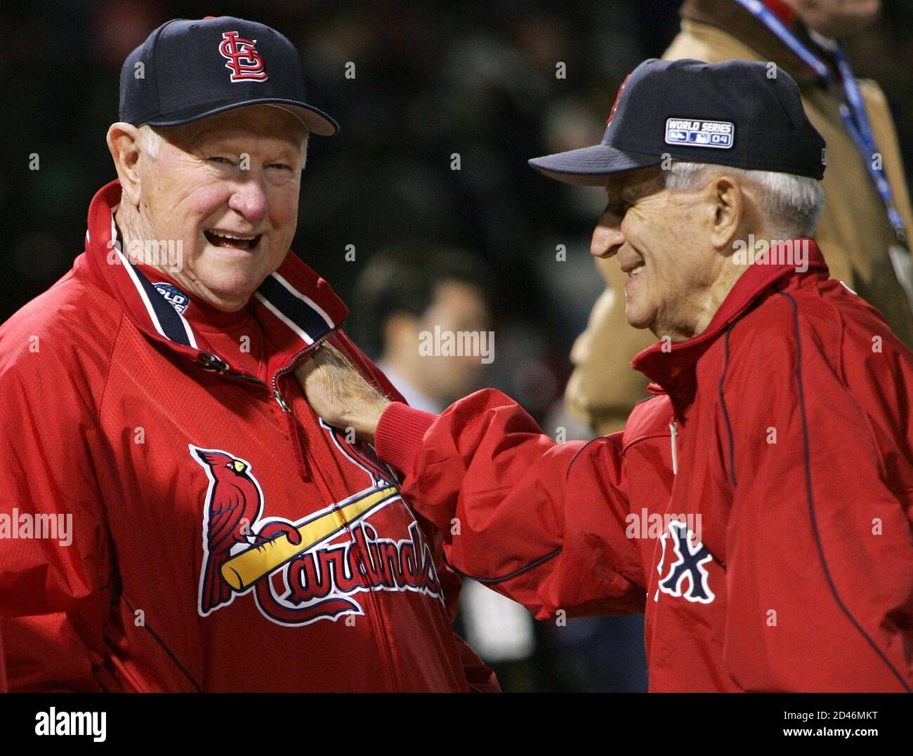 Former St. Louis Cardinals second baseman Red Schoendienst (L) talks with  former Boston Red Sox shortstop Johnny Pesky before Game 1 of the World  Series between the Red Sox and Cardinals at