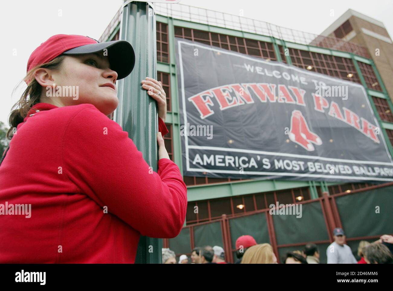 Boston Red Sox fan Christina Baudis watches for arriving players before  Game 1 of the World Series between the Red Sox and St. Louis Cardinals at  Fenway Park in Boston on October