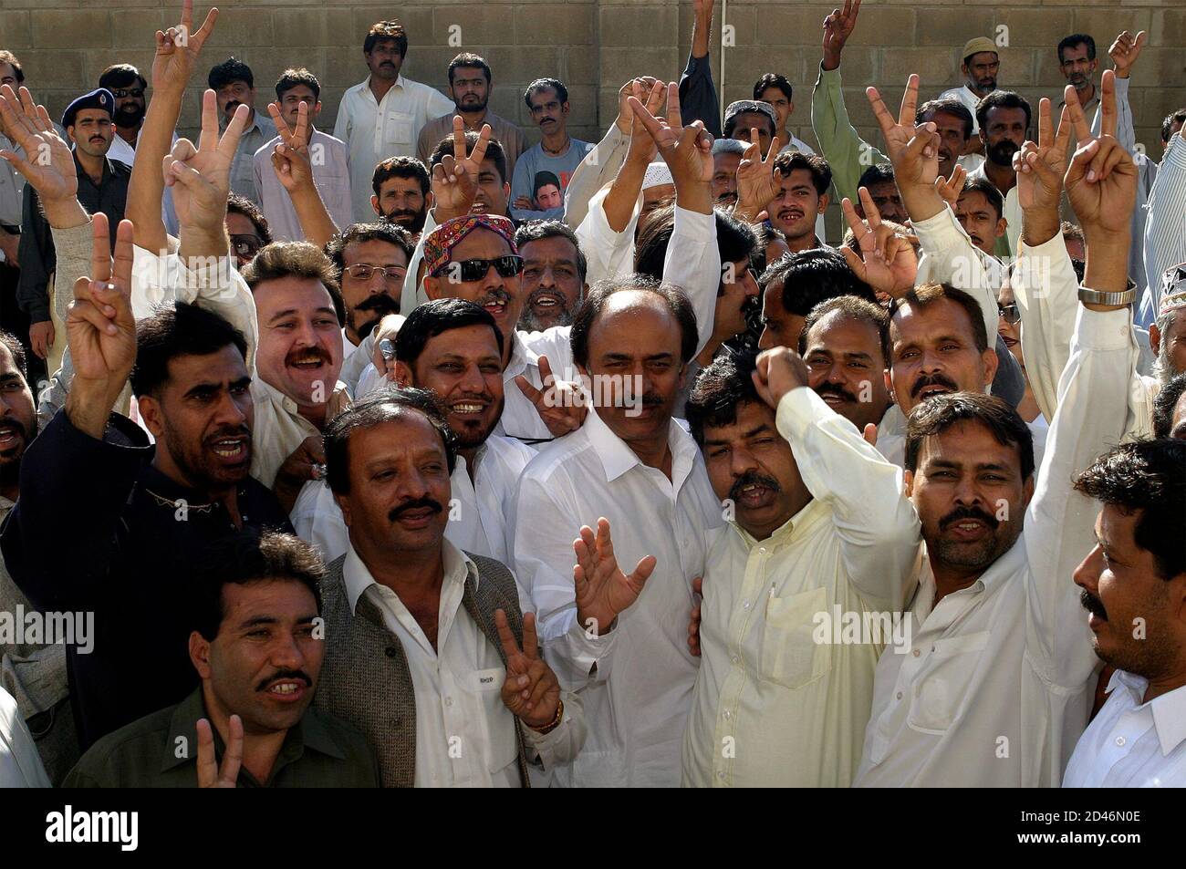 Supporters of opposition Pakistan People's Party celebrate court's decision to grant bail to Asif Zardari in Karachi.  Supporters of the opposition Pakistan People's Party celebrate a Pakistani court's decision to grant bail to Asif Ali Zardari, husband of Pakistan's former prime minister Benazir Bhutto, in Karachi November 22, 2004. The court on Monday granted bail to him and the government said the decision would result in his release after eight years in prison. REUTERS/Zahid Hussein Stock Photo