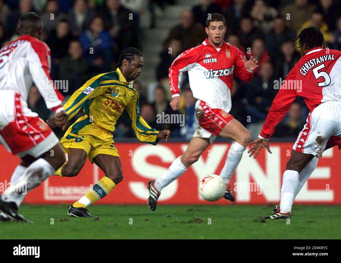 Salomon Olembe of Nantes (2L) takes the ball between Martin Djetou (L),  Philippe Chisitanval (R) and Ousman Dabo of Monaco during their French  first division match at the ' la Beaujoire' stadium