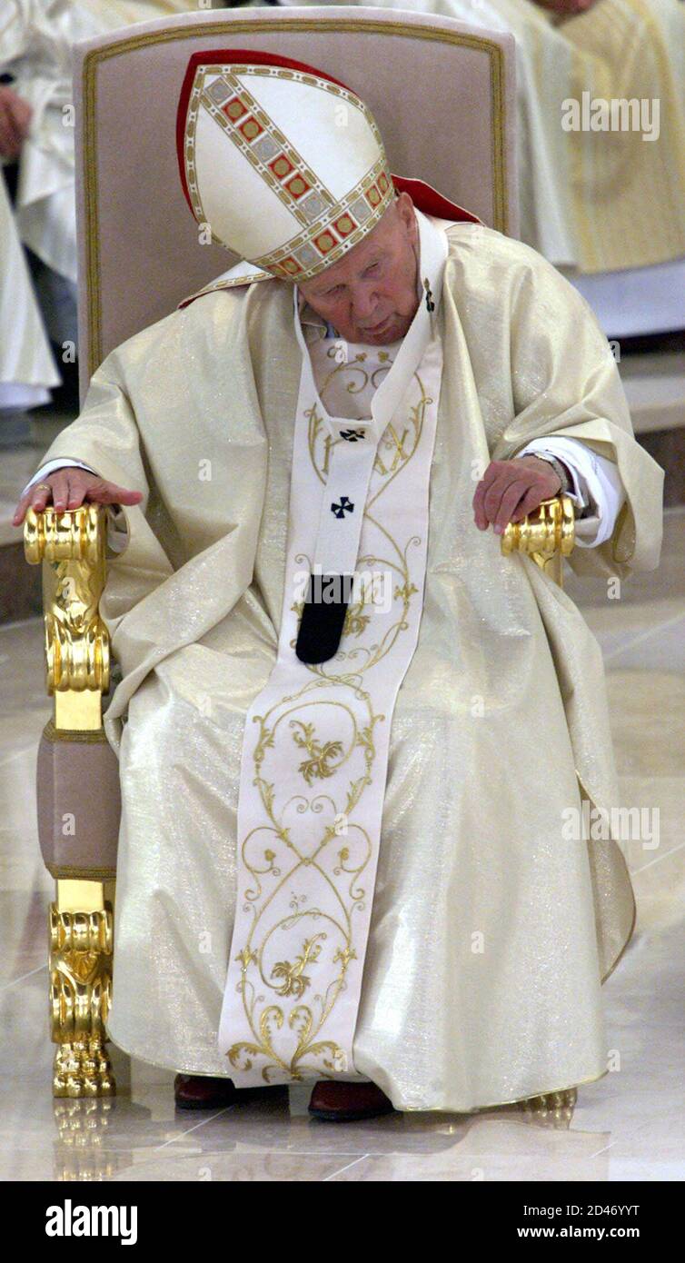 Pope John Paul II sits during mass at the Lagiewniki Sanctuary in Krakow  August 17, 2002. The 82-year-old Pope has returned to his native Poland for  the ninth time to spend four