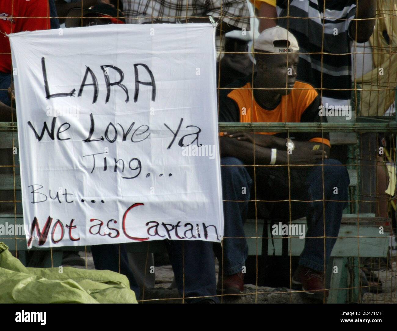 Cricket fans at the Bourda Cricket Grounds show their disapproval of West Indies captain Brian Lara and the way the team is playing, during the second day of the first test in Georgetown, Guyana, April 11, 2003. Fans have been criticizing the West Indies' performance so far. REUTERS/Andy Clark  AC/HB Stock Photo
