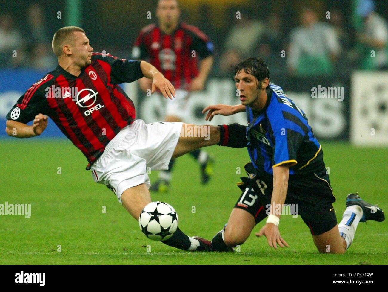 AC Milan's Andriy Shevchenko (L) challenges Marco Materazzi of Inter Milan  during their Champions League semi-final first leg clash at the San Siro  Stadium in Milan May 7, 2003. The match ended