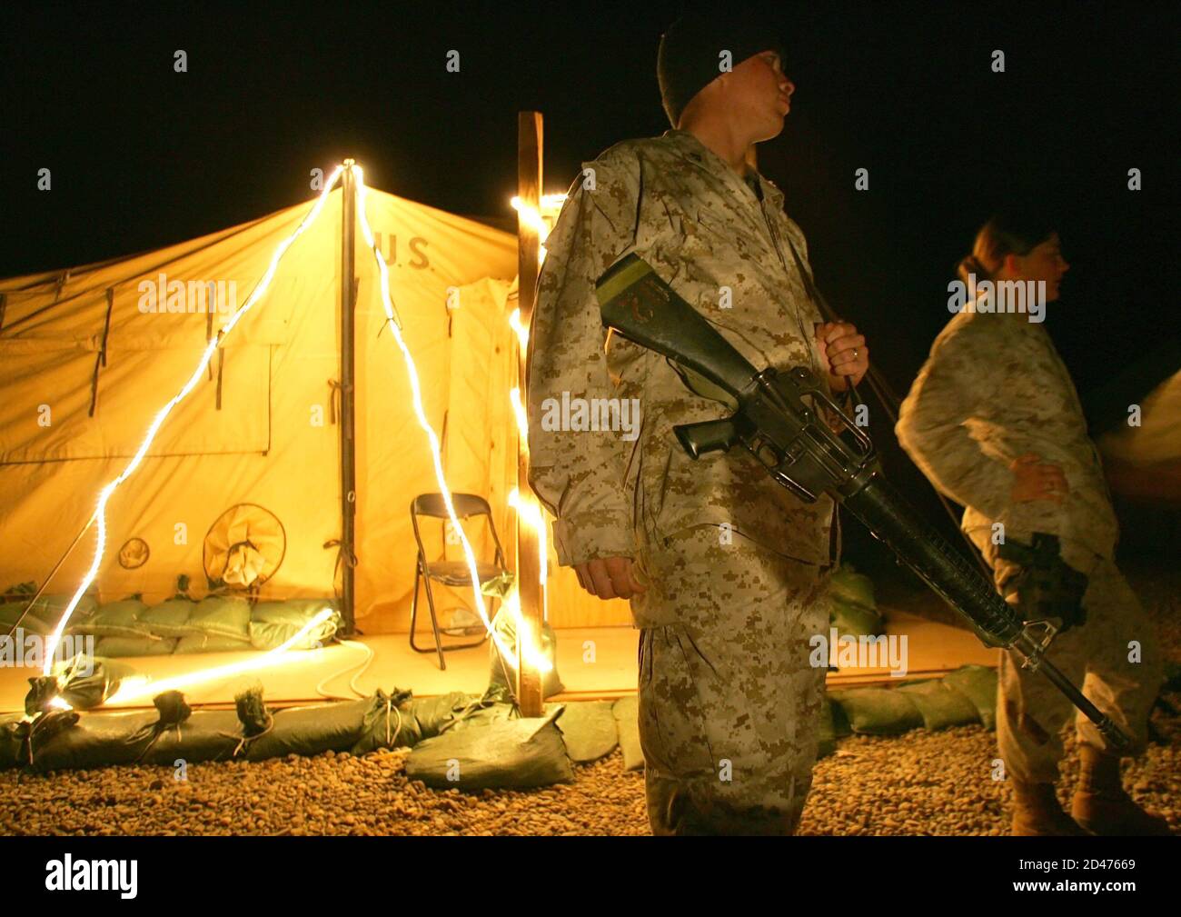 U.S Marines from 31st Marine Expeditionary Unit stand in front of a tent decorated for Christmas in their camp near restive town of Falluja, 50 kms west of Baghdad December 10, 2004. REUTERS/Shamil Zhumatov  SZH/AA Stock Photo