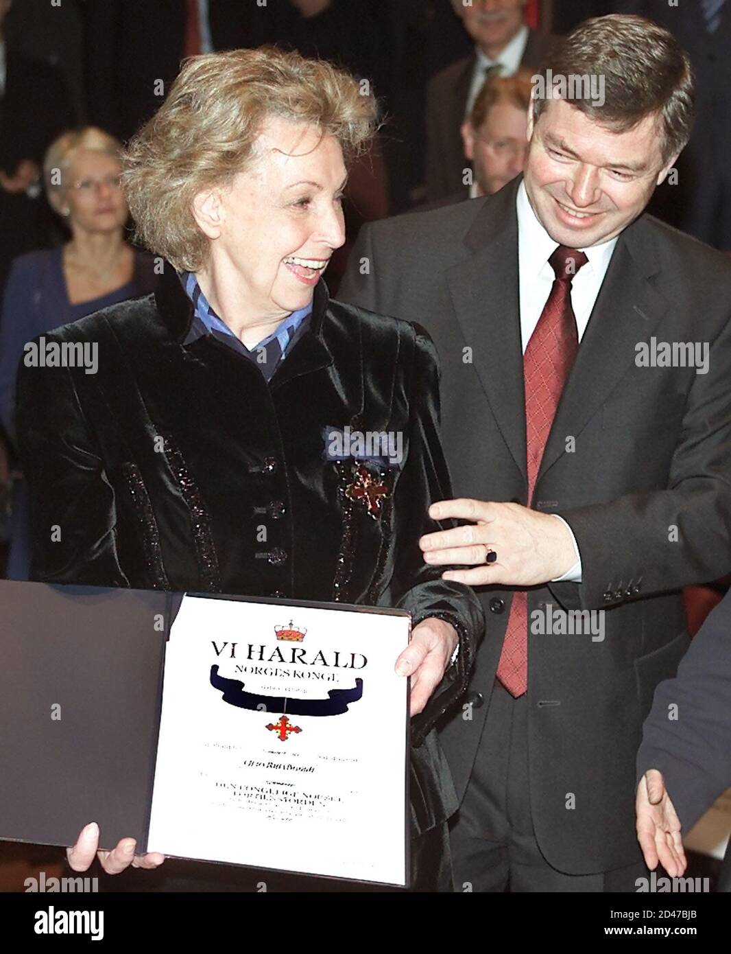 Rut Brandt (L), widow of former German Chancellor Willy Brandt smiles after she was honoured by the Norwegian Prime Minister Kjell Bondevik during a ceremony at the Norwegian embassy in Berlin December 3, 2001. Rut Brandt was honoured with the Norwegian royal medal for her services to Norway. REUTERS/Tobias Schwarz REUTERS  FAB/JOH Stock Photo