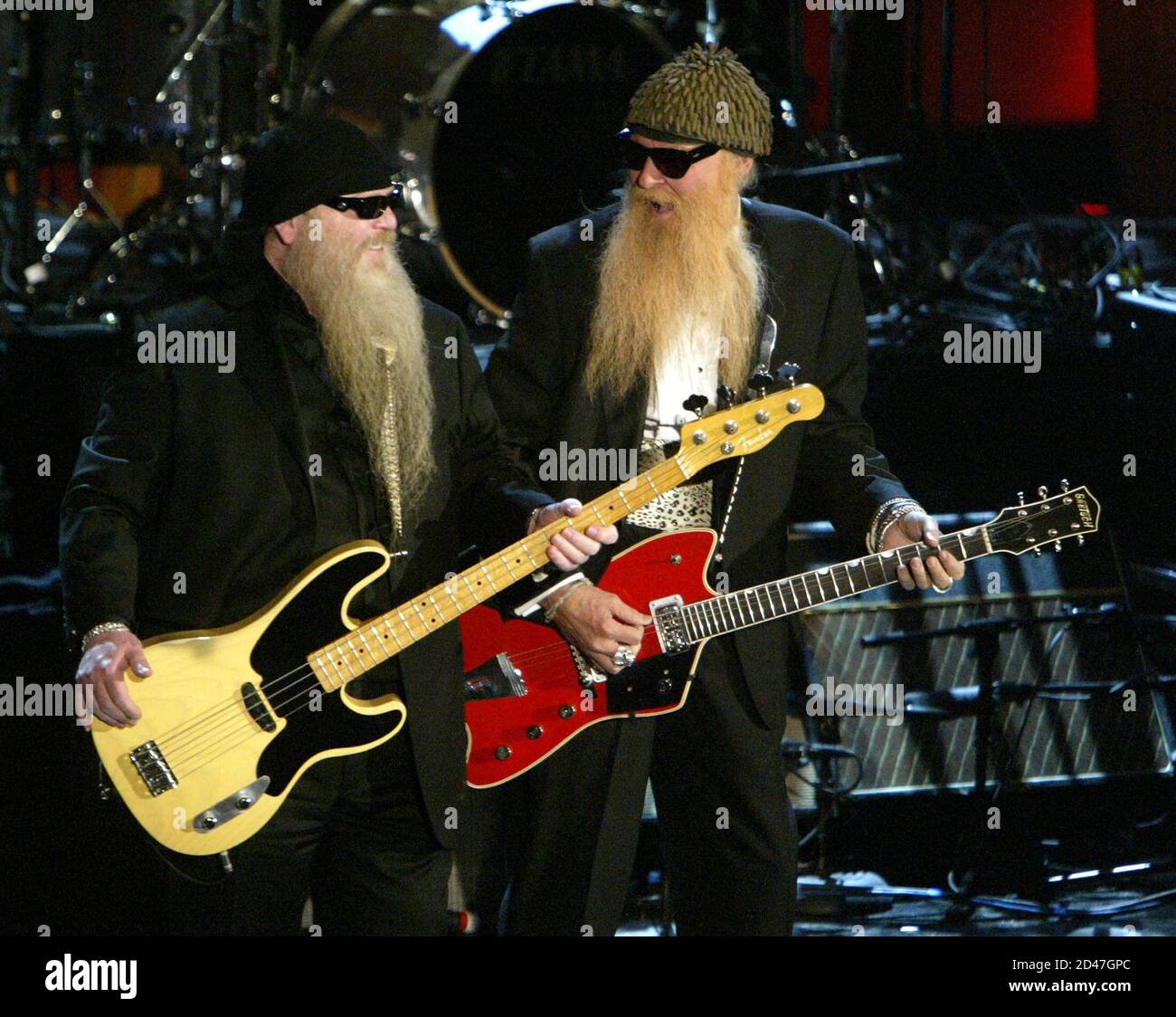 ZZ Top members Billy Gibbons (R) and Dusty Hill perform at the 19th Annual  Rock and Roll Hall of Fame Induction Ceremony in New York on March 15,  2004. The band was