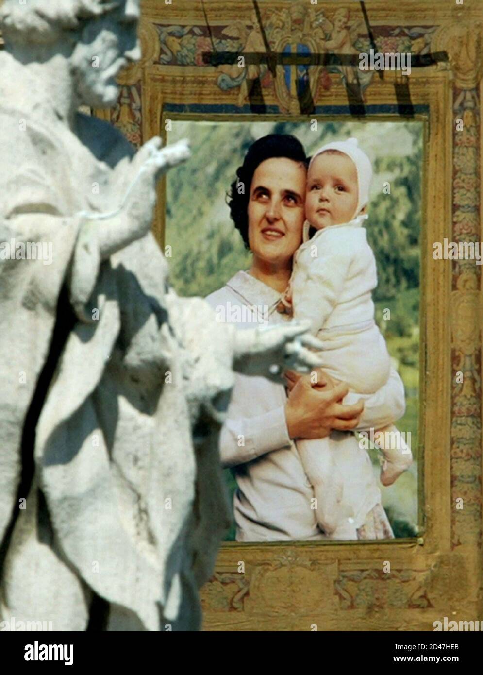 A tapestry depicting Italian Gianna Beretta Molla hangs from Saint Peter's facade during a canonization ceremony [led by Pope John Paul II] at the Vatican May 16, 2004. [The Pope created six] new saints [on Sunday canonizing Italian woman Gianna Beretta Molla, two Italian priests, Luigi Orione and Annibale Maria di Francia, Italian nun Paola Elisabetta Cerioli, Lebanese priest Nimatullah Kassab Al-Hardini and Spanish priest Josep Manyanet Y Vives.] Gianna Beretta Molla became a symbol of the anti-abortion movement for saving her unborn child at the cost of her own life. Stock Photo