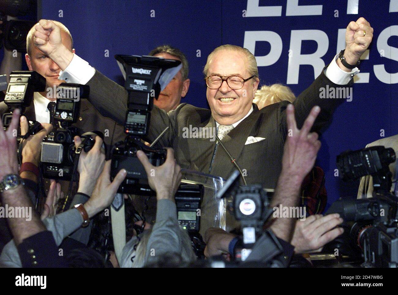 French extreme right National Front party leader Jean-Marie le Pen salutes  supporters at his campaign headquarters in Saint Cloud near Paris, April  21, 2002 [after beating French socialist Prime Minister Lionel Jospin