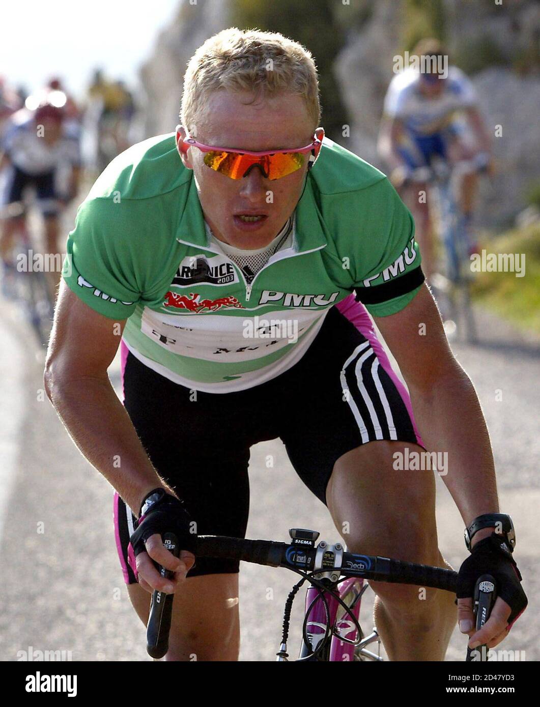 Kazakhstan's Alexander Vinokourov breaks away on the Mont-Faron climb to  win the fifth stage of the Paris-Nice cycling race in Toulon, March 14,  2003. Vinokourov dedicated his victory to compatriot Andrei Kivilev