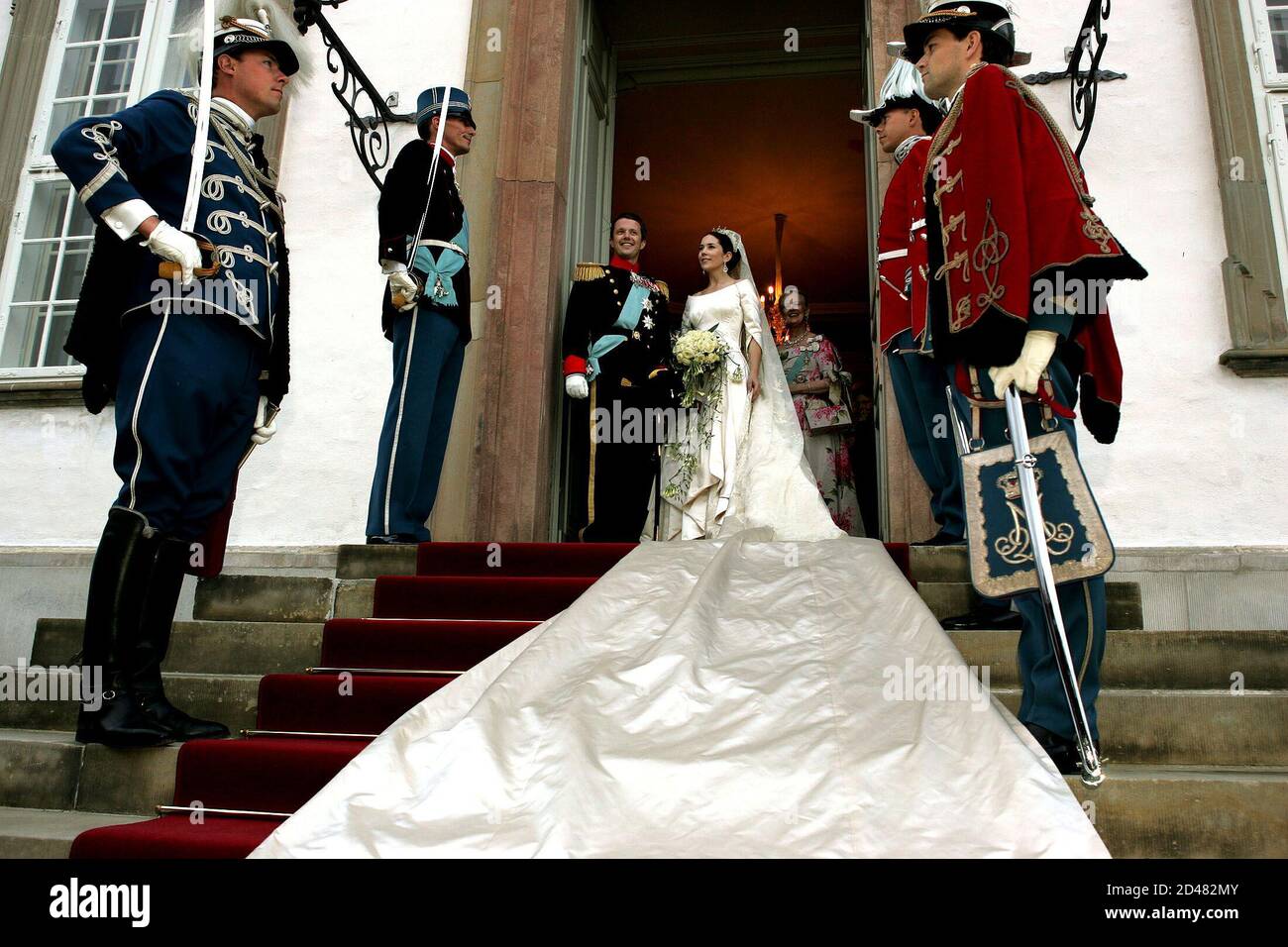 Danish Crown Prince Frederik and his newly wed wife Crown Princess Mary  pose for photographers before the Wedding banquet in Fredensborg Palace on  the outskirts of Copenhagen May 14, 2004. [Thousands of