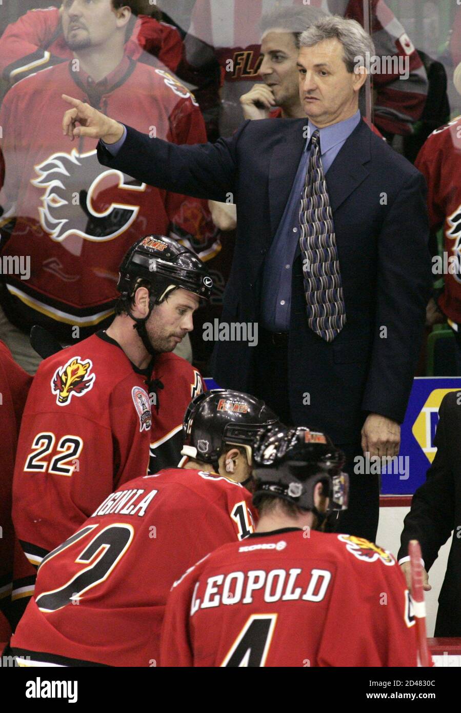 Calgary Flames head coach Darryl Sutter directs his team during a time out  in the last minutes of Game 4 of the Stanley Cup Finals in Calgary, Alberta  May 31, 2004. The