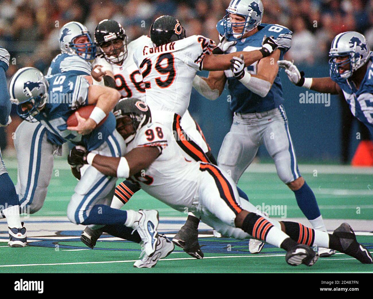 Detroit Lions' quarterback Stoney Case is sacked by Chicago Bears' Bryan Robinson December 24, 2000 during the second quarter of the NFL game at the Pontiac Silverdome in Pontiac, Michigan. Case replaced Lion's quarterback Charlie Batch after he was roughed up in a play. Chicago beat Detroit 23-20.  RC/RCS Stock Photo