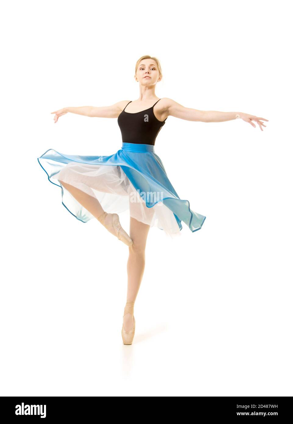 woman in a blue skirt and a black leotard dance ballet. Studio shot on