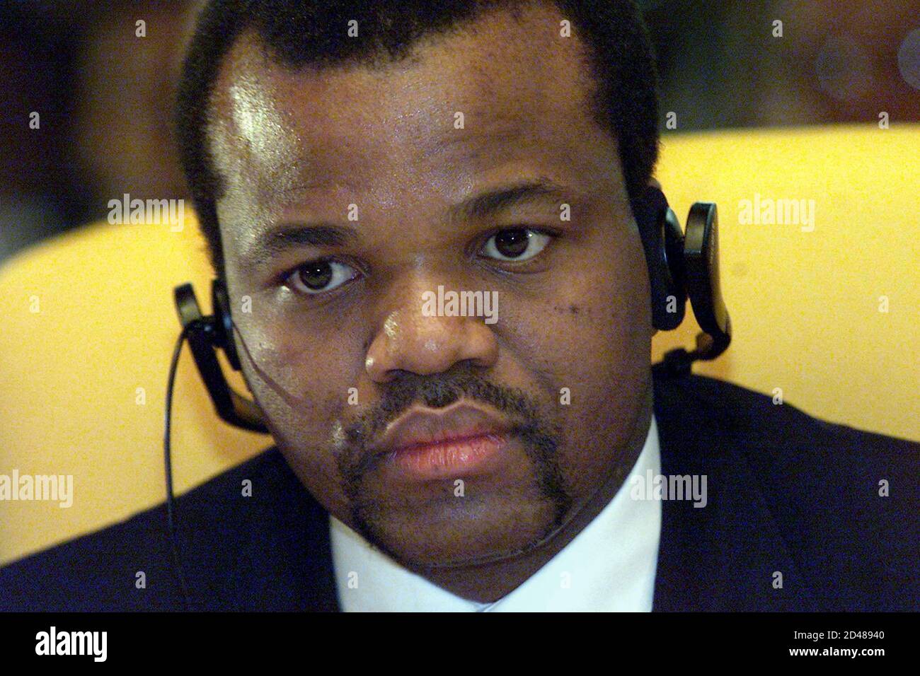 Swaziland's King Mswati III listens during the opening of the 37th OAU  summit at the Mulungushi conference centre July 9, 2001. African heads of  state opened an historic summit on Monday that