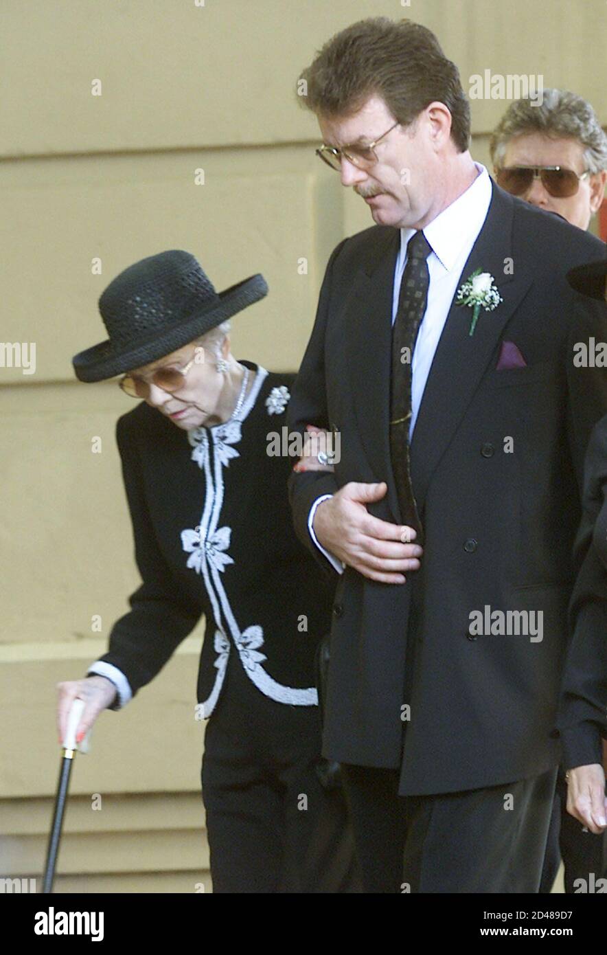 Former U S President Ronald Reagan S First Wife And Mother Of Maureen Reagan Jane Wyman L Is Escorted By Dennis Revell Husband Of Maureen Into The Cathedral Of The Blessed Sacrament For The