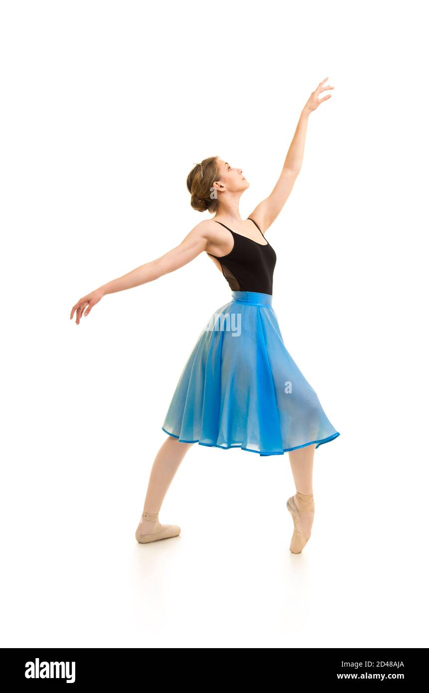 woman in a blue skirt and a black leotard dance ballet. Studio shot on