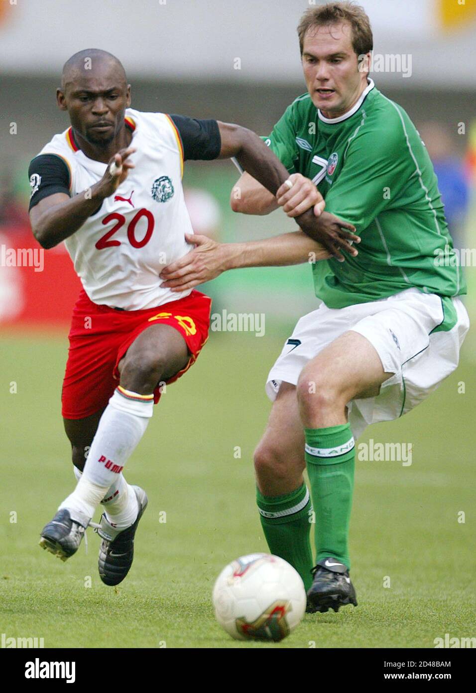Ireland's Jason McAteer (R) tries to stop Cameroon's Salomon Olembe during  their Group E match at the World Cup Finals in Niigata, June 1, 2002.  REUTERS/Kieran Doherty CVI/JP Stock Photo - Alamy