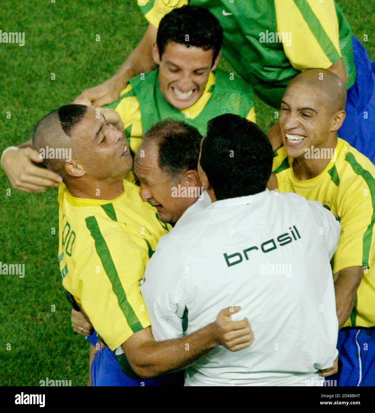 Brazil S Ronaldo L Celebrates With Coach Luiz Felipe Scolari With Head On Ronaldo S Chest Team Mates Belletti Top Roberto Carlos R And An Assistant Coach After Scoring His First Goal Against Germany