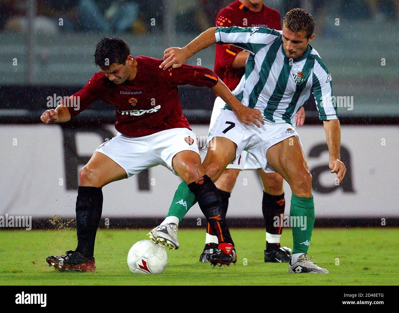 As Roma S Cristian Chivu L Is Challenged By Fernando Valera Ramos Of Real Betis During Their