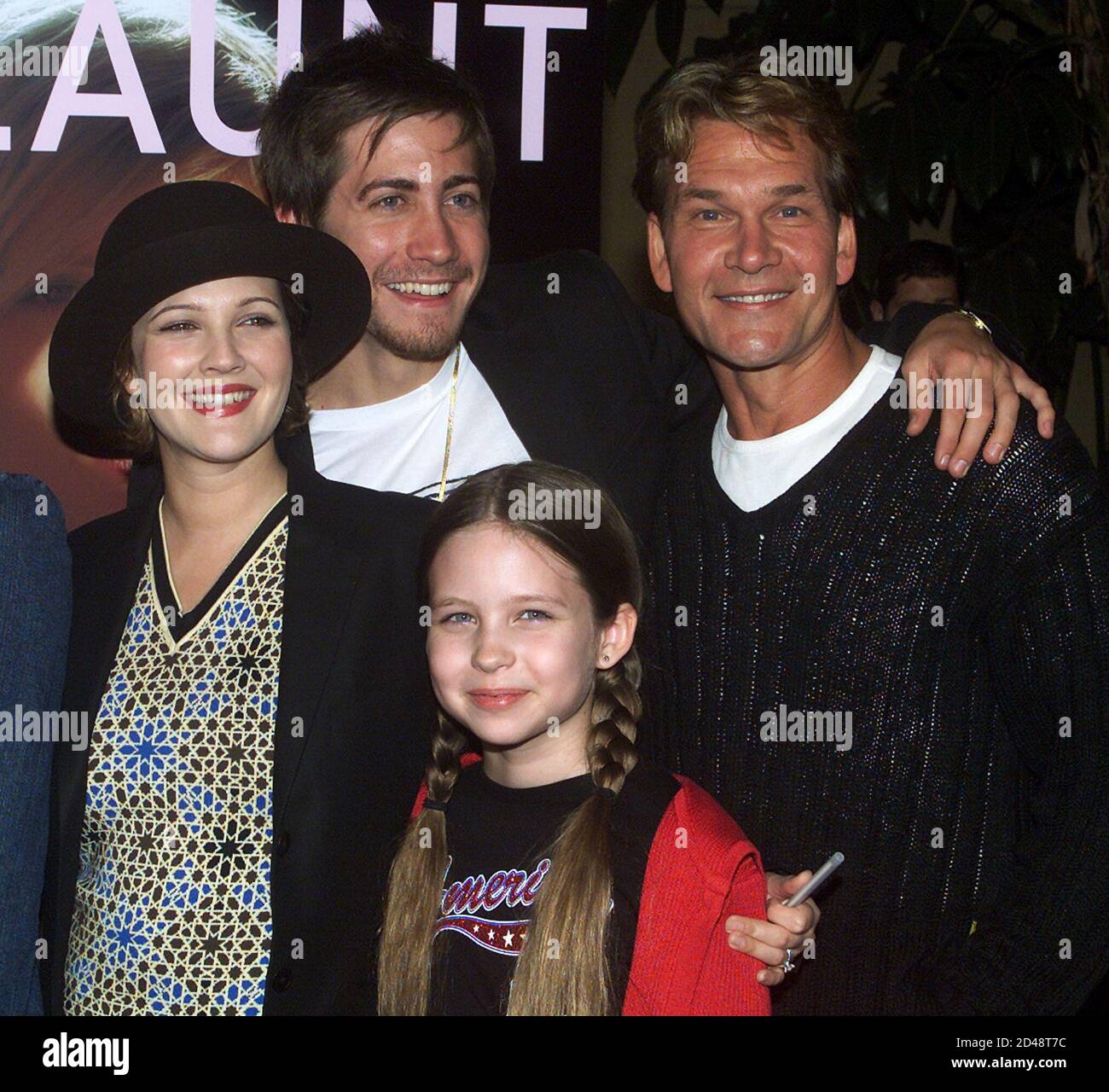 Executive producer Drew Barrymore (L), poses with fellow cast members Jake  Gyllenhaal, Patrick Swayze (R), and Daveigh Chase as they arrive for the  premiere of their new film "Donnie Darko" October 22,