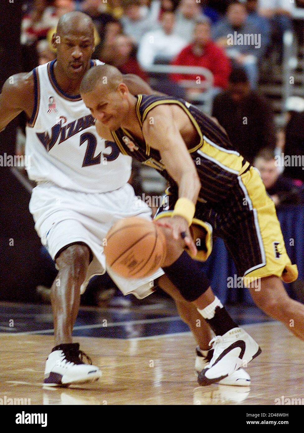 Indiana Pacers' Reggie Miller (R) tries to drive around Washington Wizards' Michael  Jordan in the second
