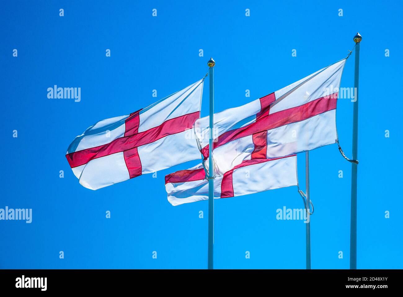 Three English flags along the A1 at the border between Scotland and England near Berwick-upon-Tweed. Stock Photo