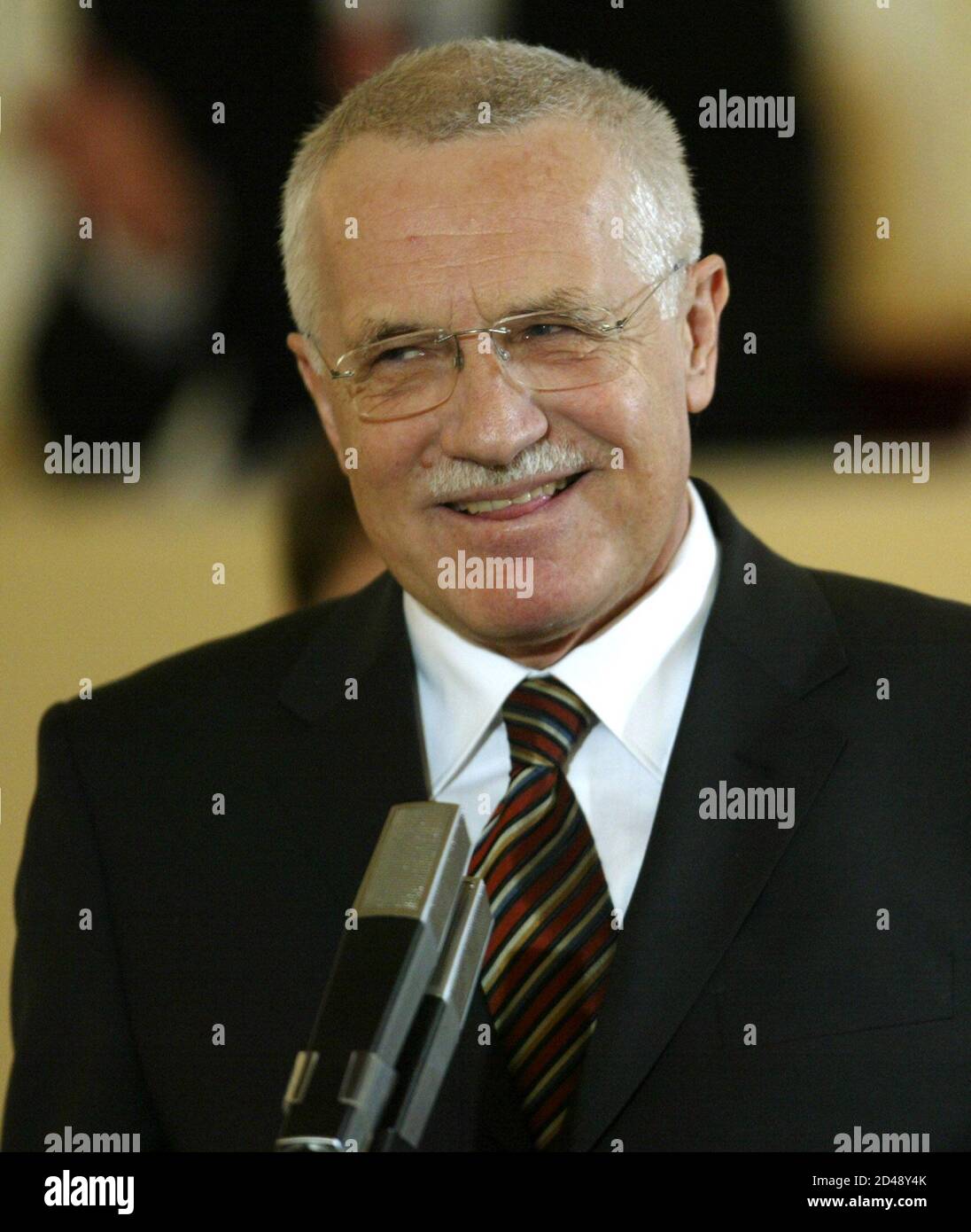 Former right-wing Czech Prime Minister Vaclav Klaus smiles during his speech at the parlimentary session in the Spanish Hall at Prague Castle January 24, 2003. Czech lawmakers began on Friday their second attempt at electing a successor to President Vaclav Havel, but the battle to replace East Europe's elder statesman is likely to collapse once again amid political wrangling.  REUTERS/Petr Josek REUTERS Stock Photo