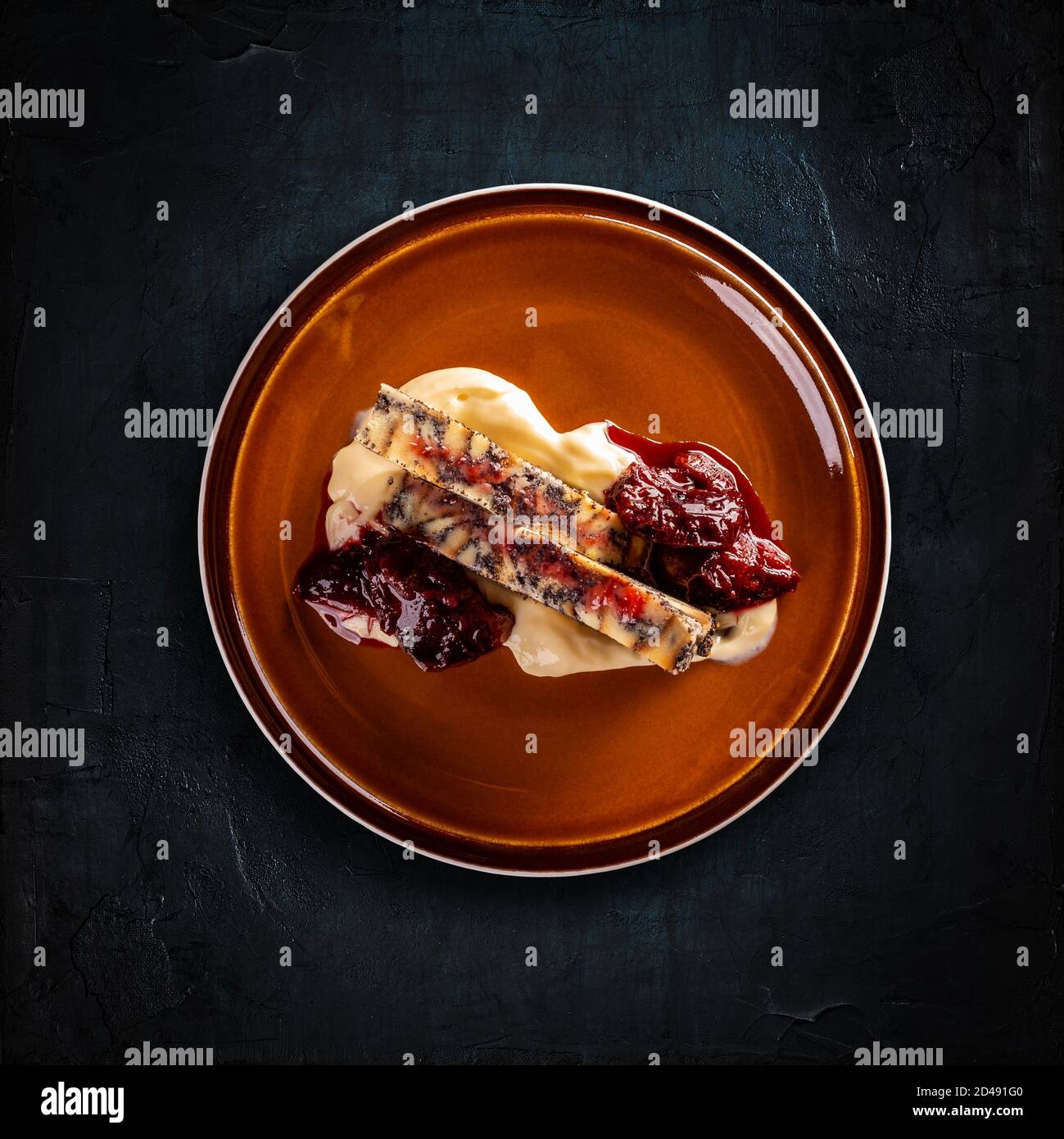 Hungarian poppy seed bread pudding with vanilla sauce and prune jam