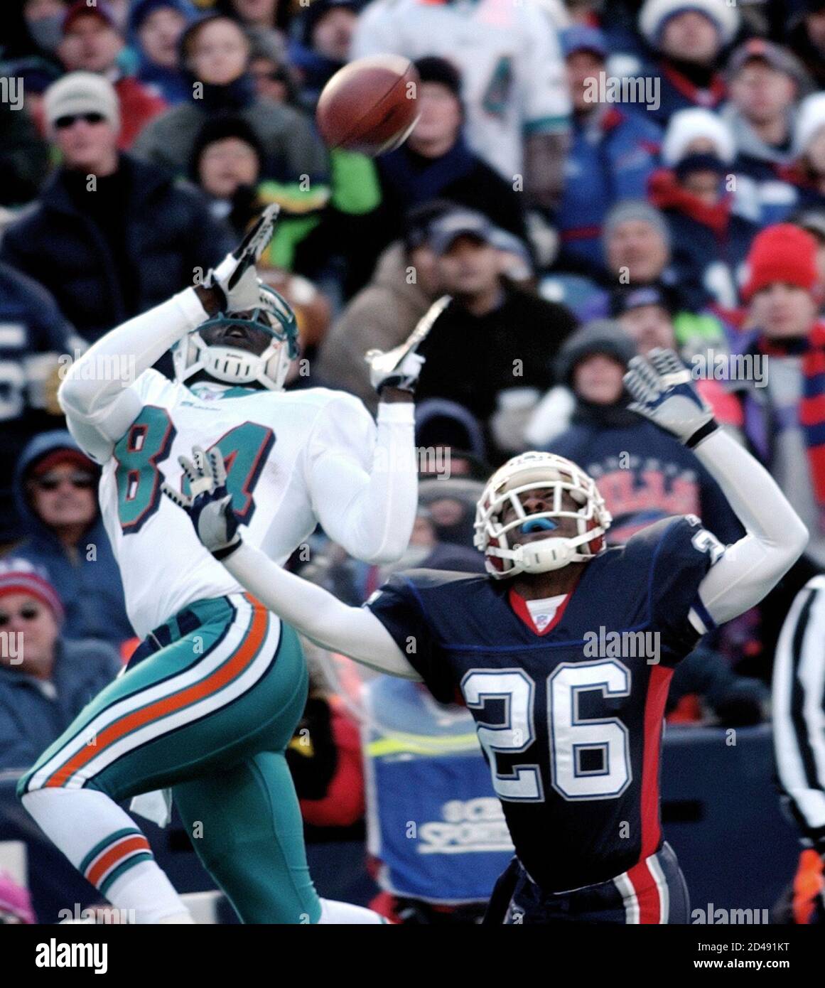 miami-dolphins-wide-receiver-chris-chambers-84-makes-a-leaping-catch-for-a-touchdown-as-buffalo-bills-cornerback-antoine-winfield-26-tries-to-block-the-pass-at-ralph-wilson-stadium-in-orchard-park-new-york-december-21-2003-the-touchdown-came-off-a-23-yard-pass-from-miami-quarterback-jay-fiedler-reutersgary-wiepert-bmgac-2D491KT.jpg